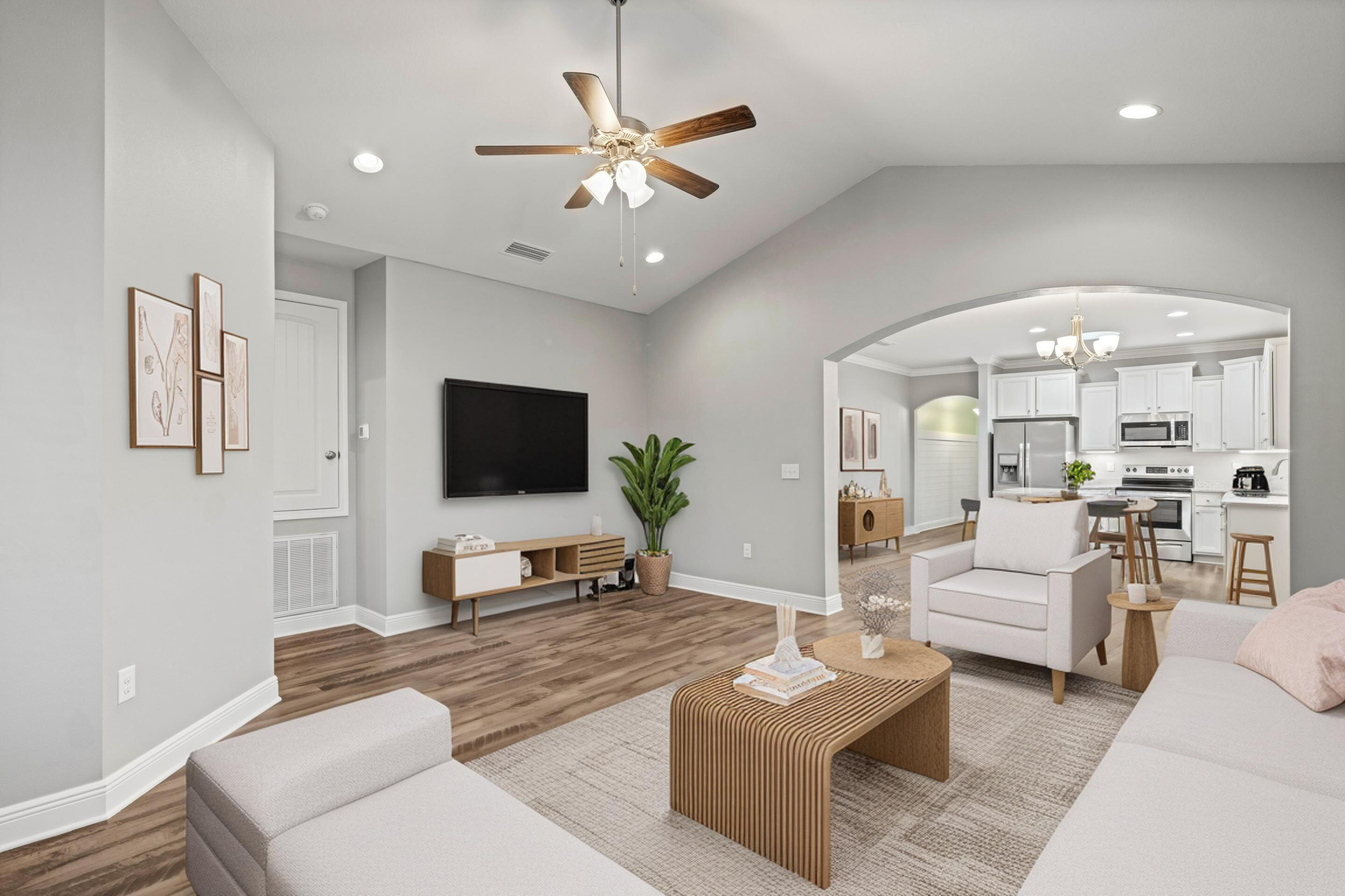521 Cornelia Street Freeport, FL 32439 - Photo 15 of 39 a living room with furniture a ceiling fan and a flat screen tv