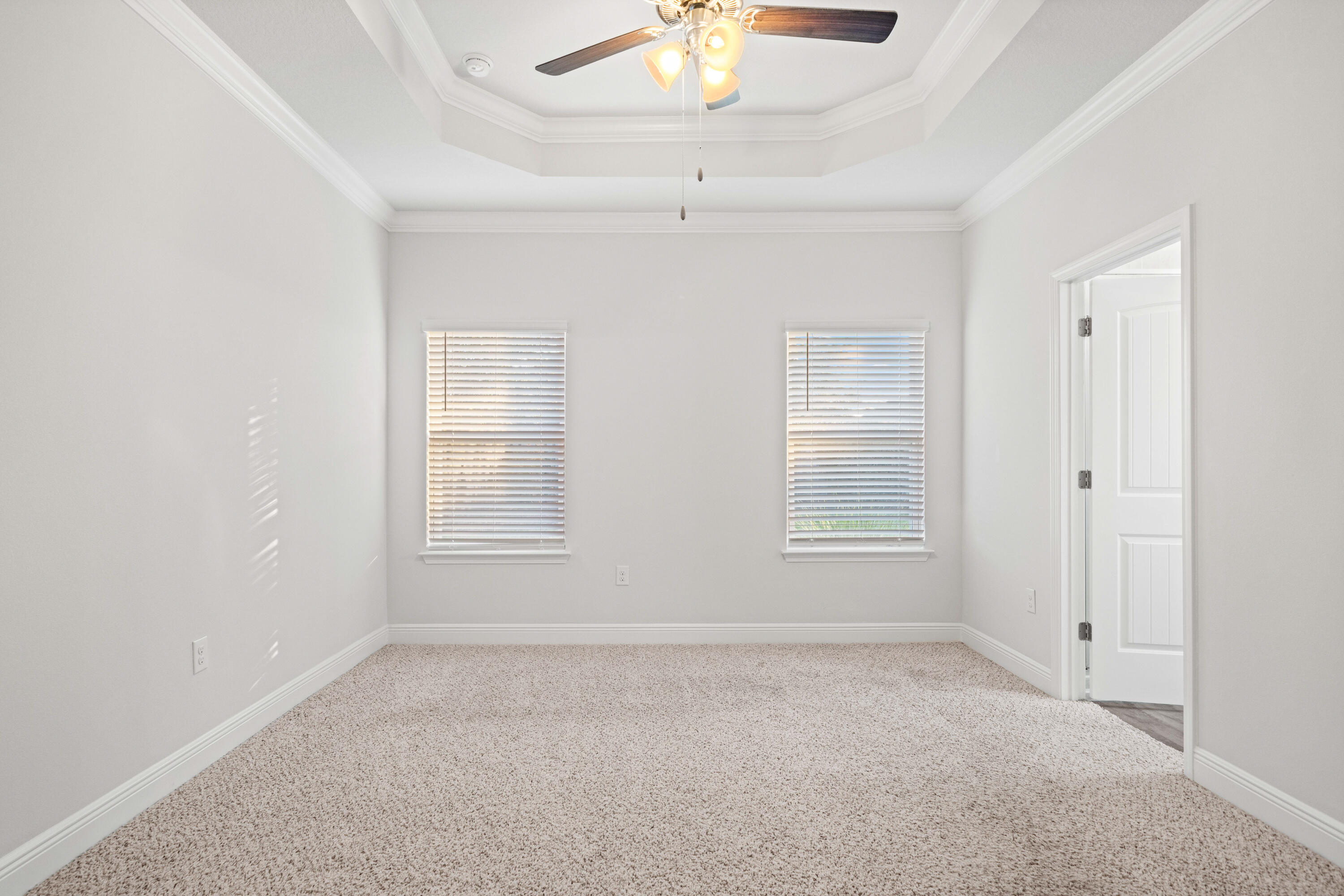 521 Cornelia Street Freeport, FL 32439 - Photo 18 of 39 an empty room with a window and a ceiling fan