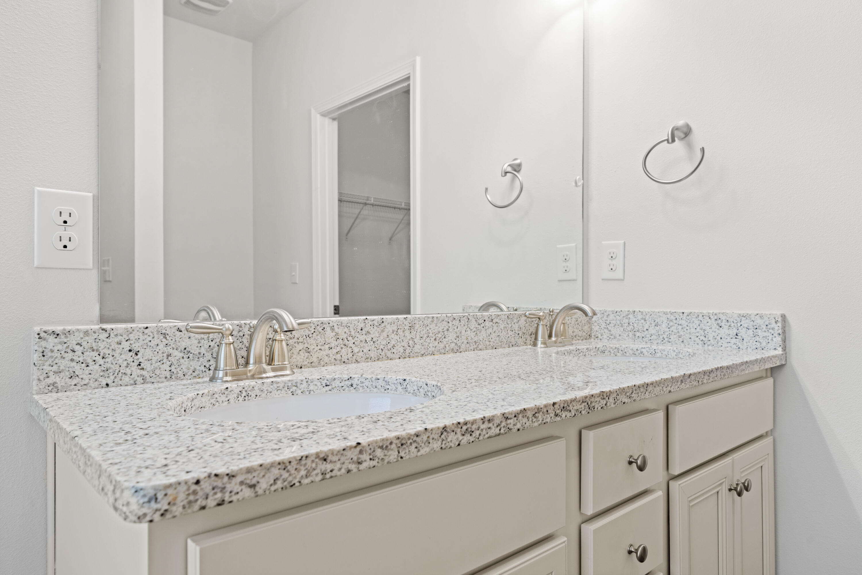 521 Cornelia Street Freeport, FL 32439 - Photo 22 of 39 a bathroom with a granite countertop sink and a mirror