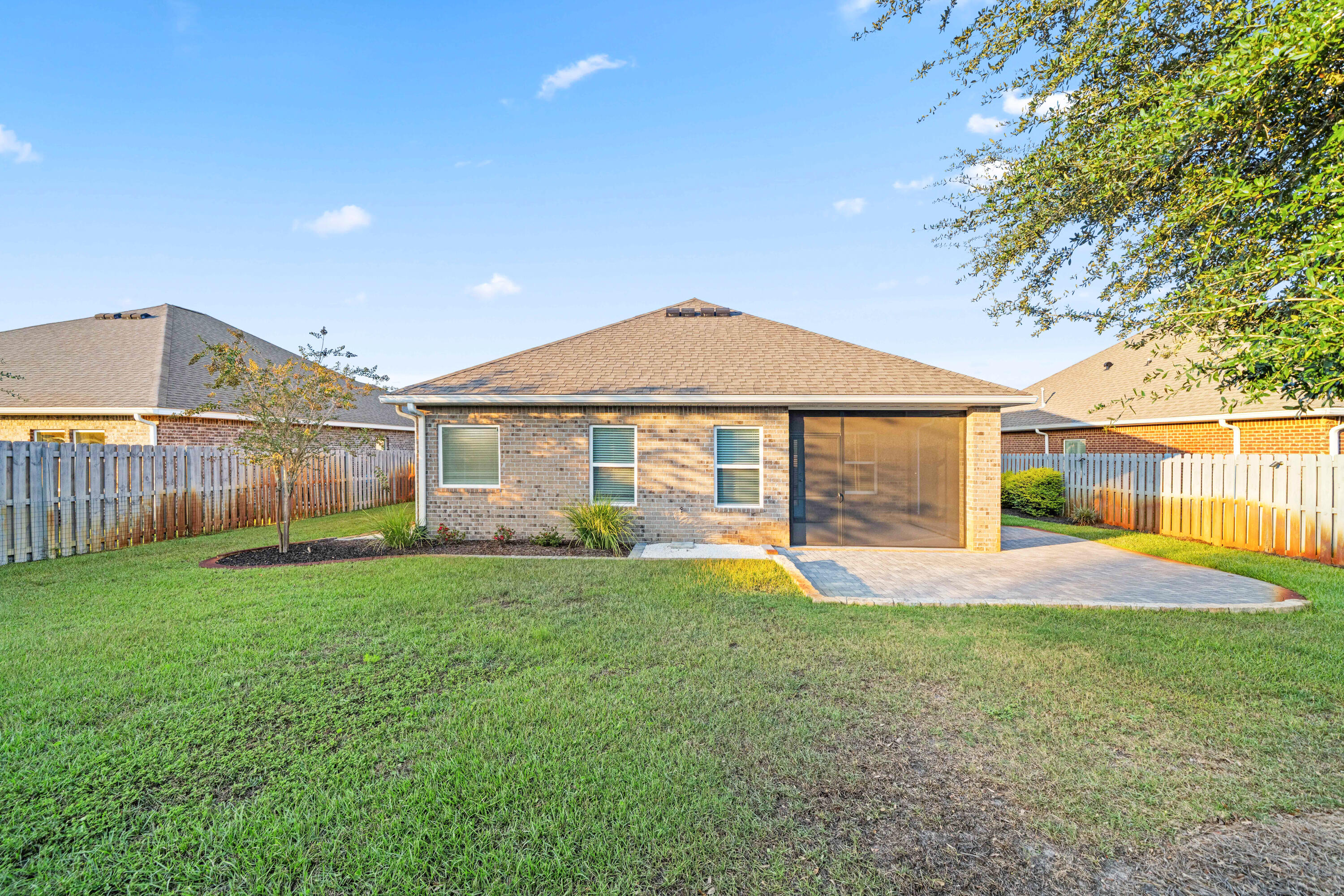 521 Cornelia Street Freeport, FL 32439 - Photo 30 of 39 a view of a house with a yard and sitting area