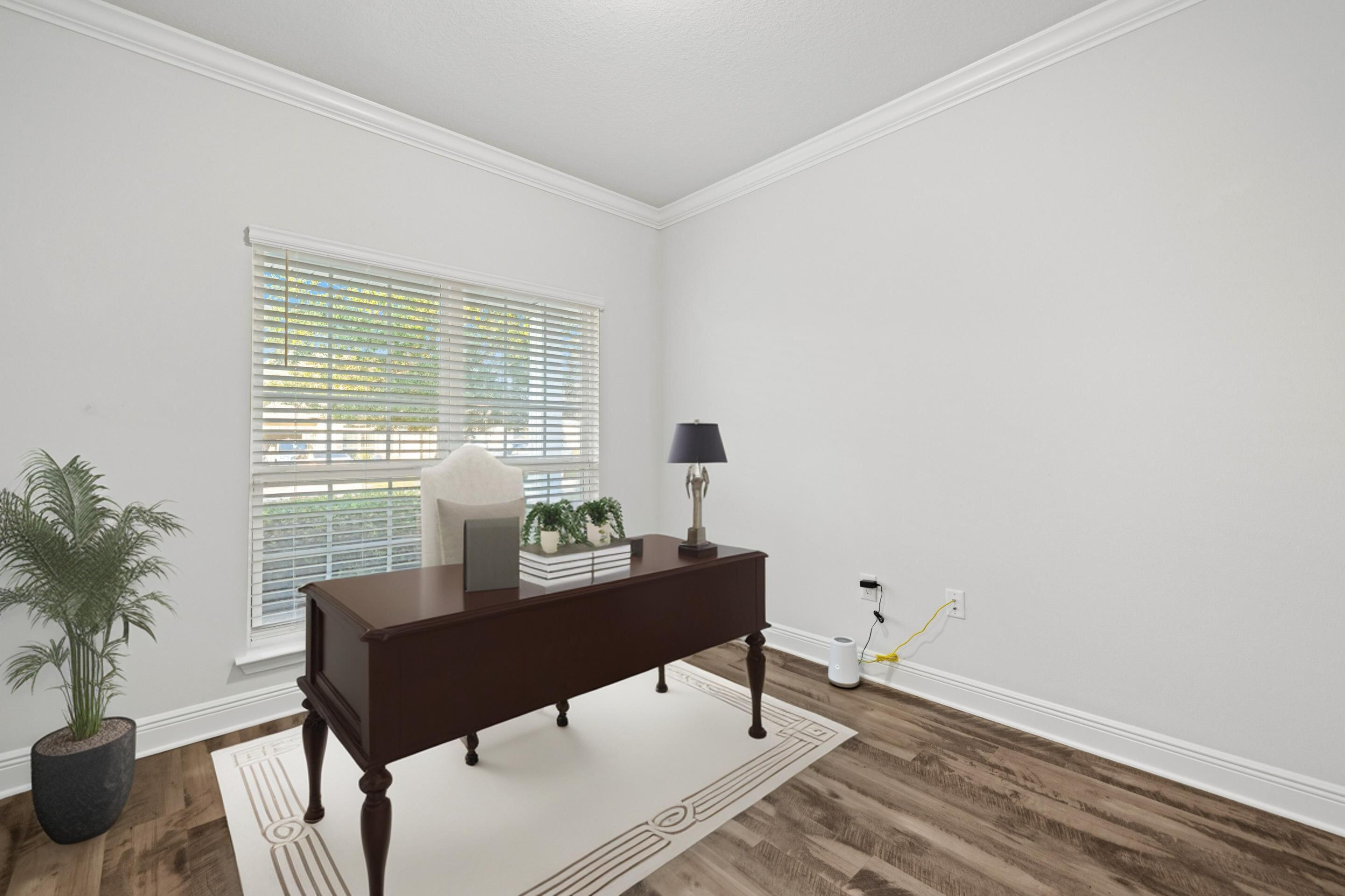 521 Cornelia Street Freeport, FL 32439 - Photo 10 of 39 a living room with furniture and a potted plant