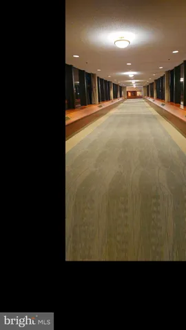 a living room with table or chairs and a umbrella