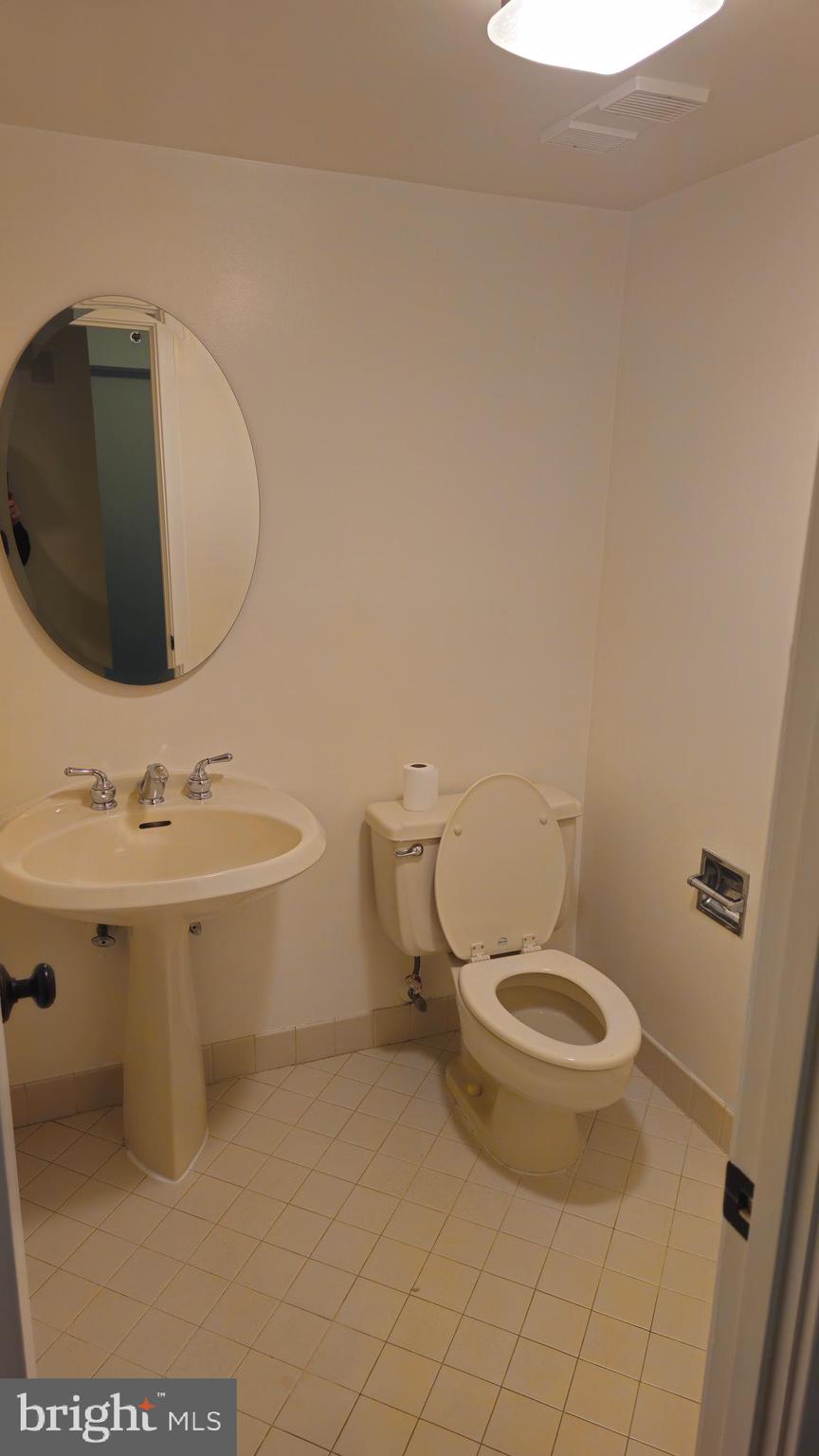 5501 Seminary Road, Unit 2502S Falls Church, VA 22041 - Photo 3 of 32 a bathroom with a sink toilet and mirror