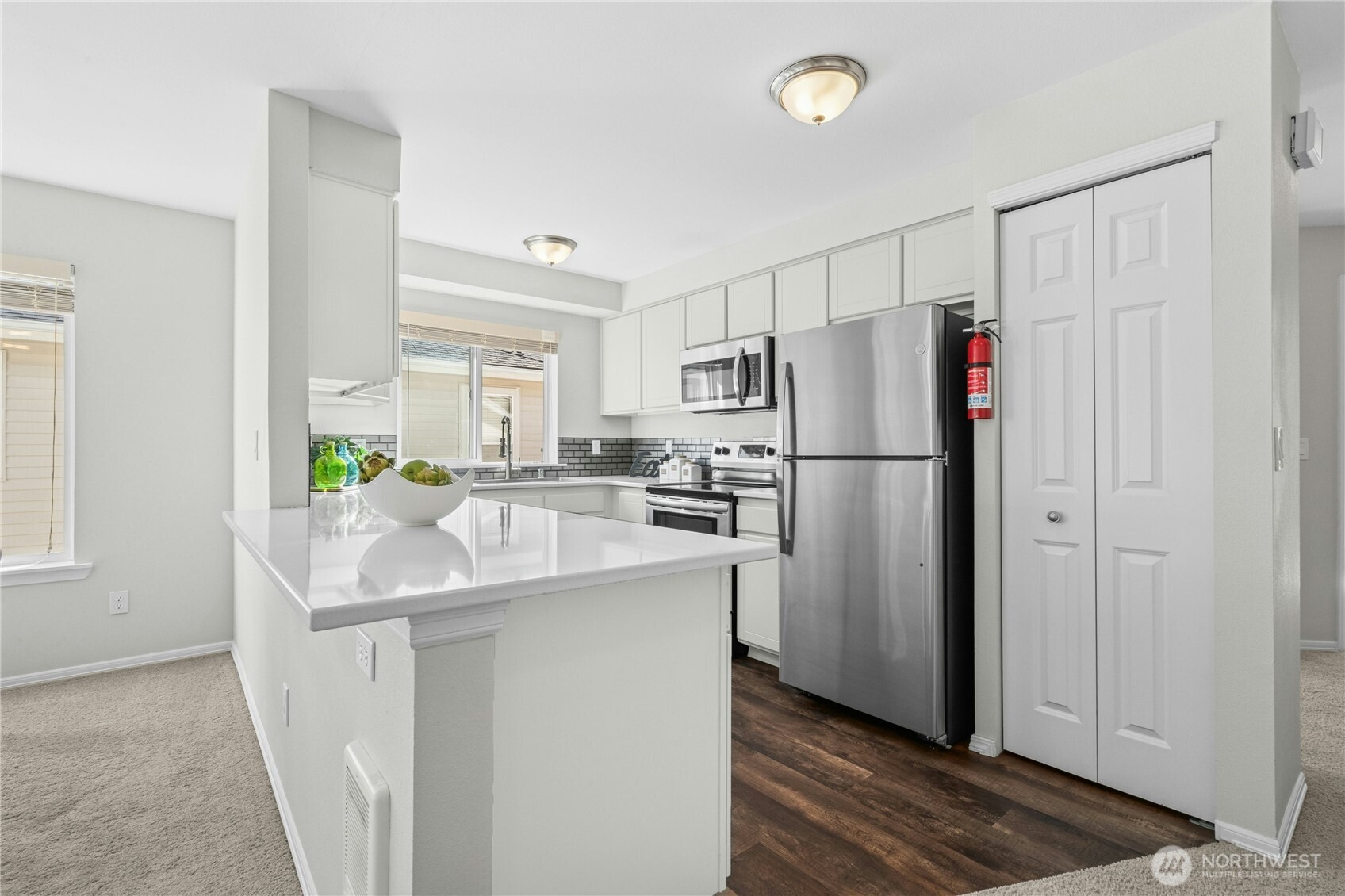 725 115th Street Southwest, Unit BB 204 Everett, WA 98204 - Photo 12 of 32 a kitchen with refrigerator and cabinets