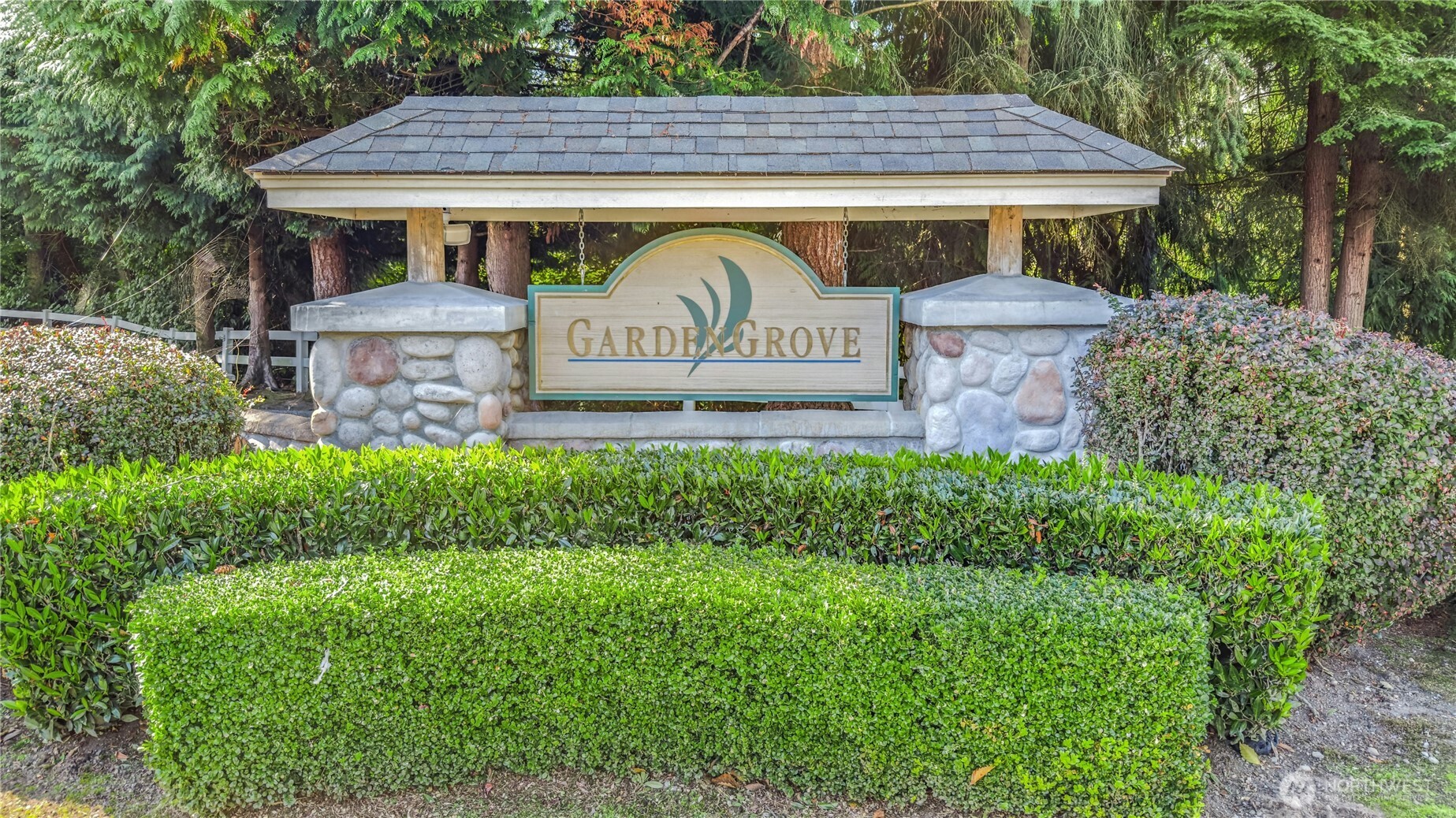 725 115th Street Southwest, Unit BB 204 Everett, WA 98204 - Photo 31 of 32 a view of a house with garden and a bench