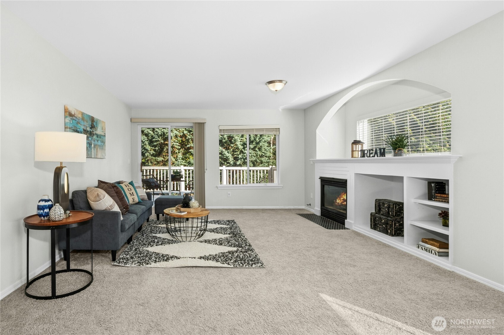 725 115th Street Southwest, Unit BB 204 Everett, WA 98204 - Photo 4 of 32 a living room with furniture a fireplace and a window