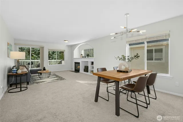 a view of a dining room with furniture and a window