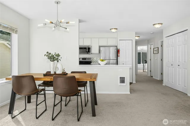 a dining room with furniture and window