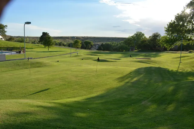 a view of a golf course with a lake