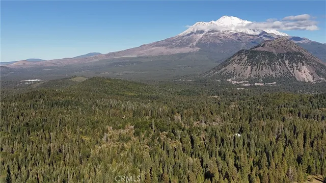 a view of a mountain with a mountain in the background