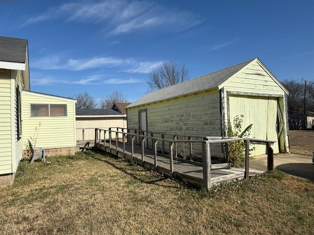 636 South Center Street Grand Prairie, TX 75051 - Photo 6 of 29 Detached single car garage with lots of extra storage space and wheelchair accessible ramp.