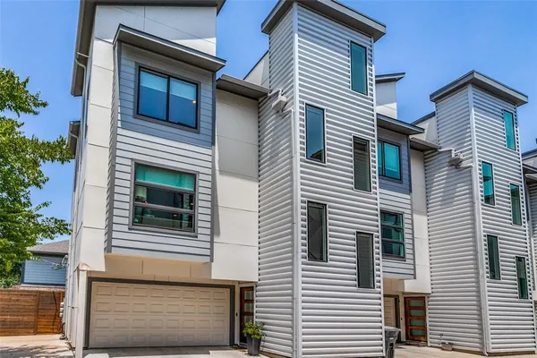 a view of a house with a door and balcony