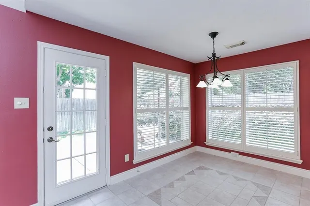 a view of empty room with windows
