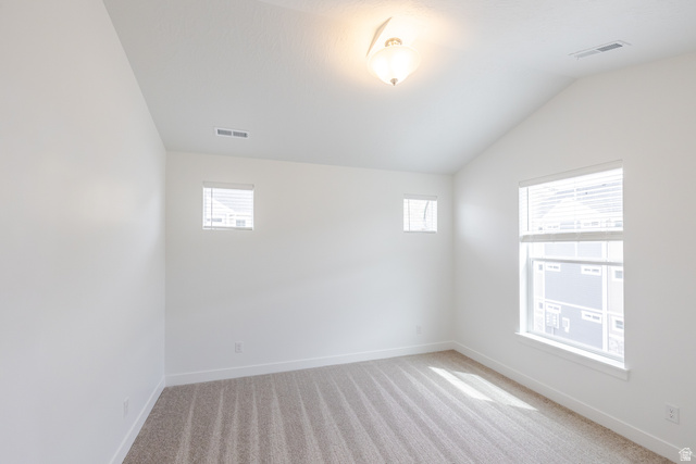 693 West 4500th South, Unit O303 Mapleton, UT 84664 - Photo 10 of 15 Unfurnished room with vaulted ceiling and light colored carpet