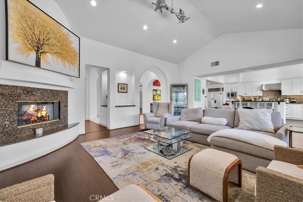 4 Oakmont Drive Rancho Mirage, CA 92270 - Photo 11 of 73 a living room with furniture a fireplace and a large window