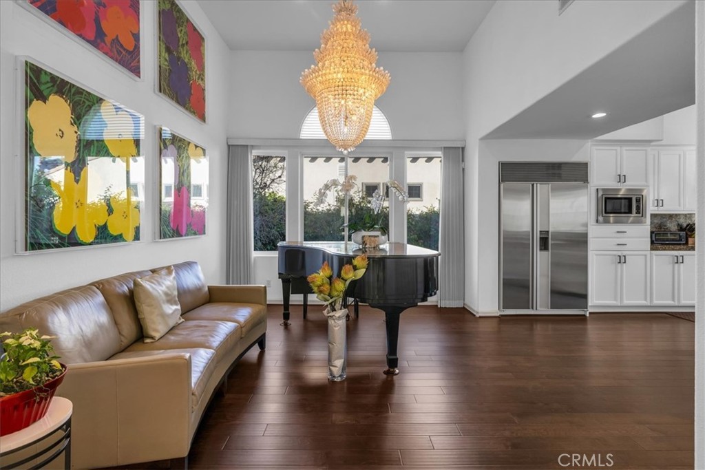 4 Oakmont Drive Rancho Mirage, CA 92270 - Photo 21 of 73 a living room with fireplace furniture and a large window