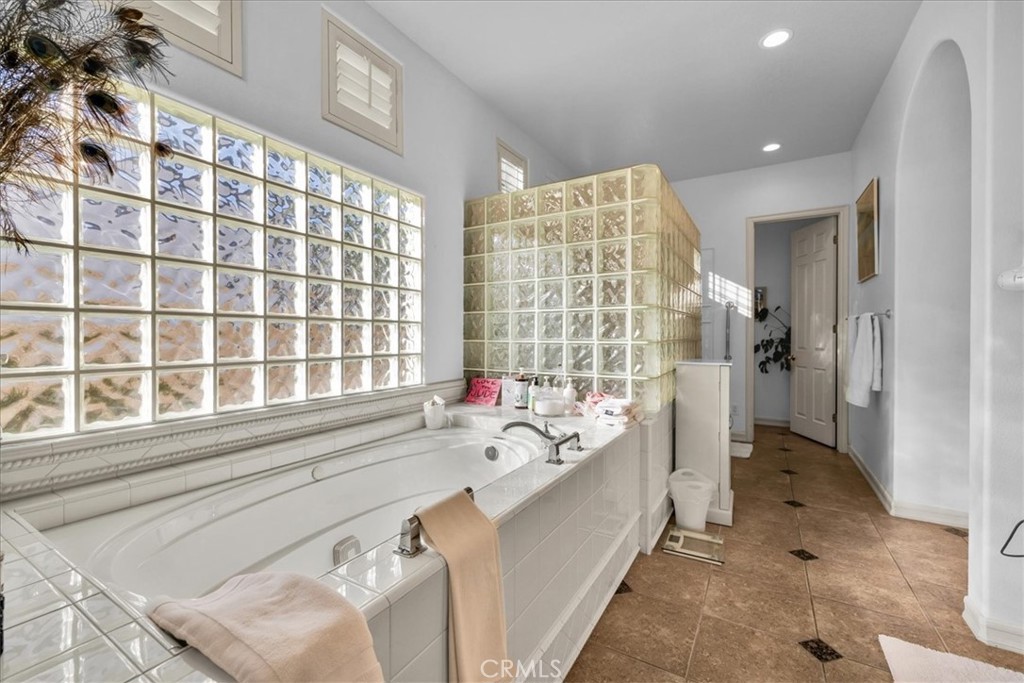 4 Oakmont Drive Rancho Mirage, CA 92270 - Photo 29 of 73 a spacious bathroom with a bathtub and a sink