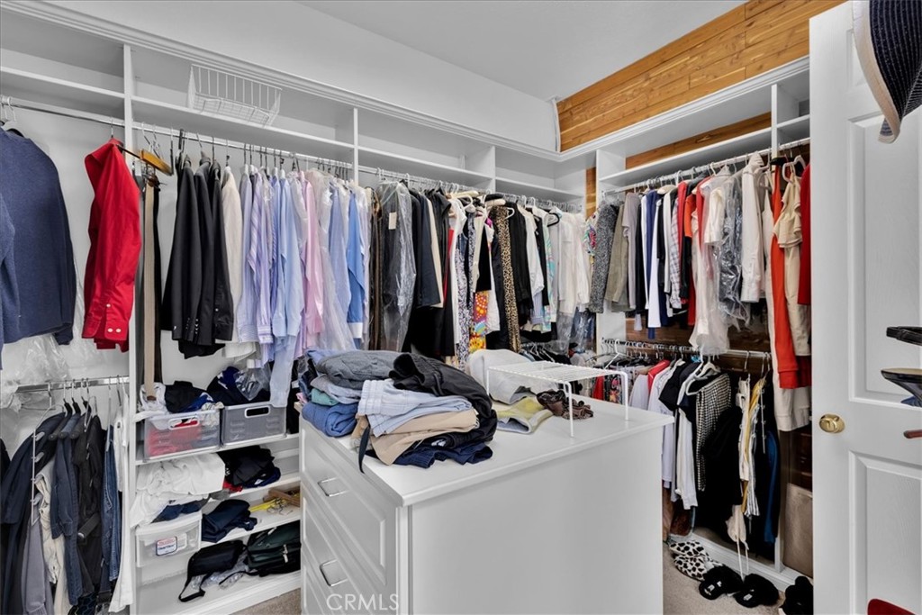 4 Oakmont Drive Rancho Mirage, CA 92270 - Photo 31 of 73 a view of walk in closet with clothes