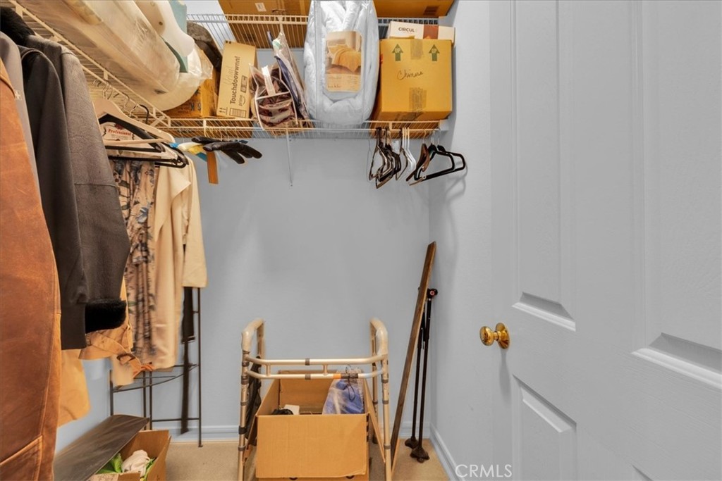 4 Oakmont Drive Rancho Mirage, CA 92270 - Photo 36 of 73 a view of walk in closet with clothes and shoes