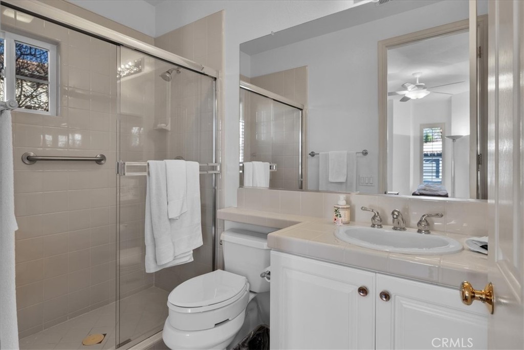 4 Oakmont Drive Rancho Mirage, CA 92270 - Photo 38 of 73 a bathroom with a sink toilet and shower