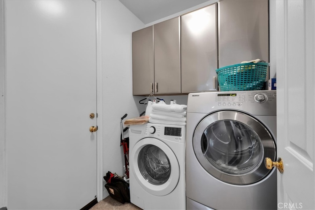4 Oakmont Drive Rancho Mirage, CA 92270 - Photo 39 of 73 a utility room with dryer and washer