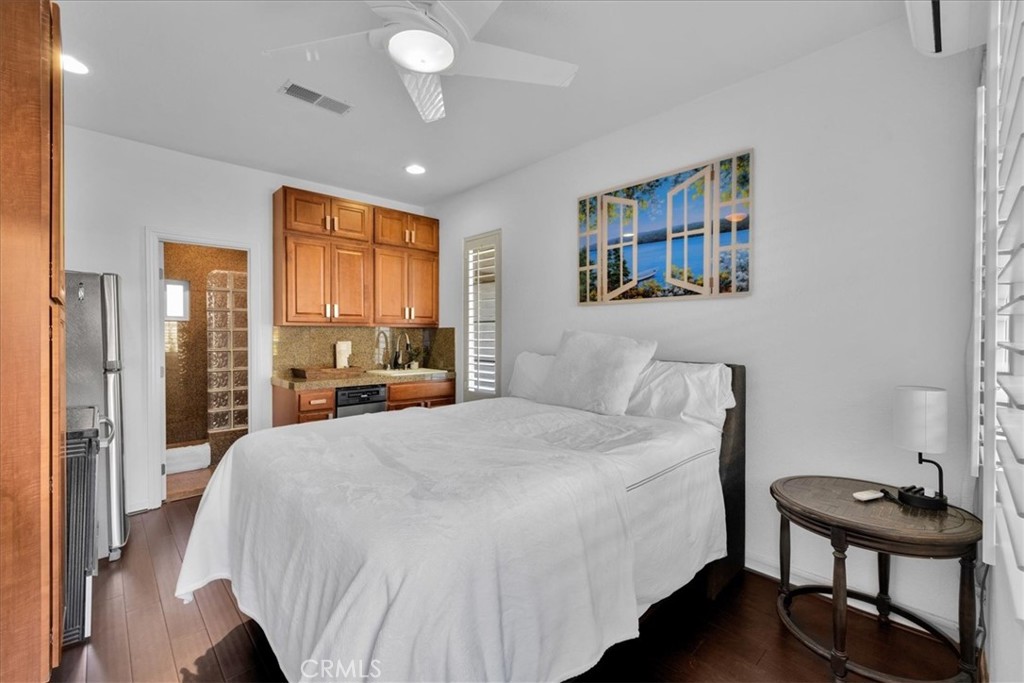 4 Oakmont Drive Rancho Mirage, CA 92270 - Photo 41 of 73 a bedroom with a bed and a table in it