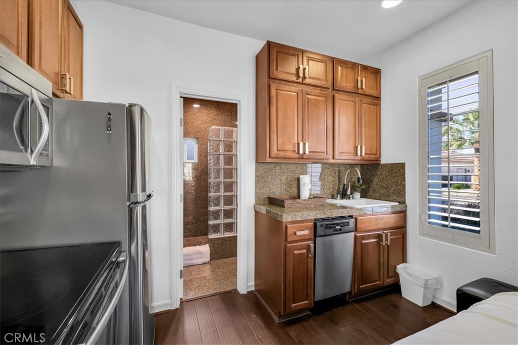 4 Oakmont Drive Rancho Mirage, CA 92270 - Photo 43 of 73 a kitchen with stainless steel appliances granite countertop a stove a refrigerator and a cabinets