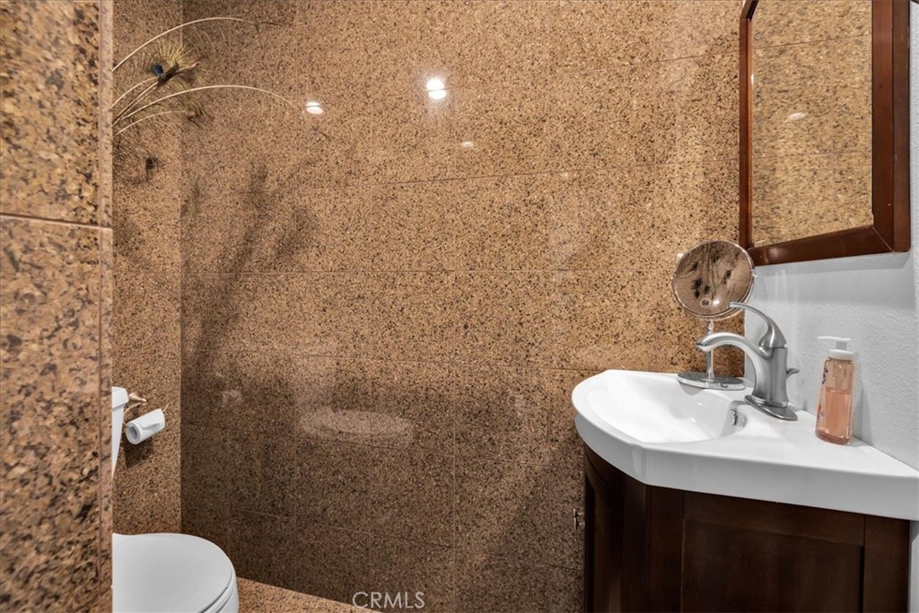 4 Oakmont Drive Rancho Mirage, CA 92270 - Photo 45 of 73 a bathroom with a sink a toilet and shower