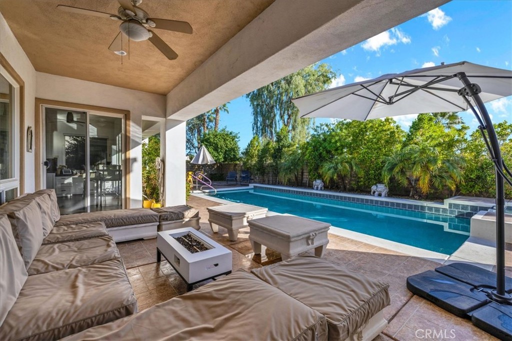 4 Oakmont Drive Rancho Mirage, CA 92270 - Photo 47 of 73 a outdoor space with patio the couches and a dining table with the view of garden