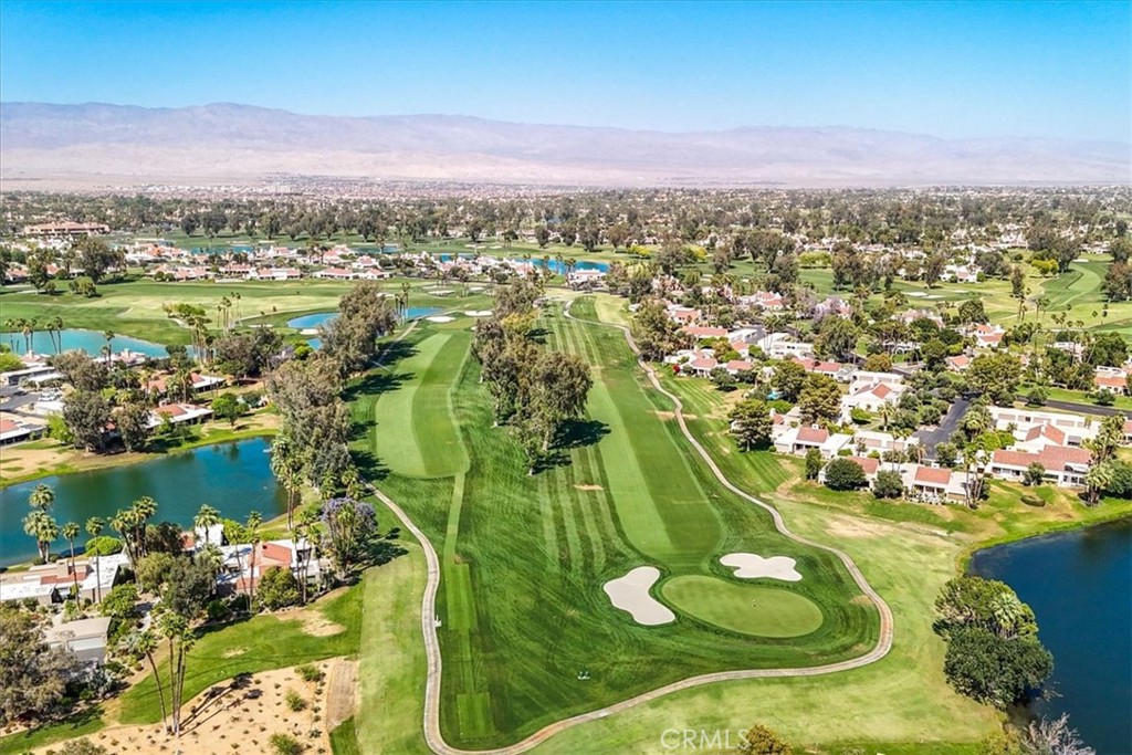 4 Oakmont Drive Rancho Mirage, CA 92270 - Photo 64 of 73 a view of a lake with a mountain