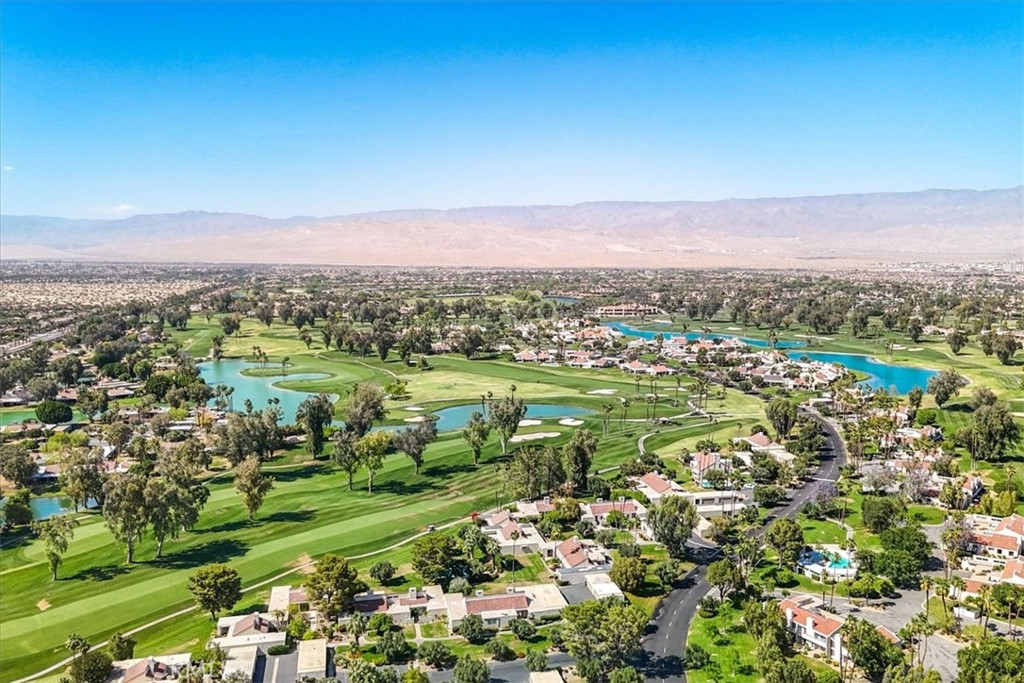 4 Oakmont Drive Rancho Mirage, CA 92270 - Photo 66 of 73 a view of a city with mountains in the background