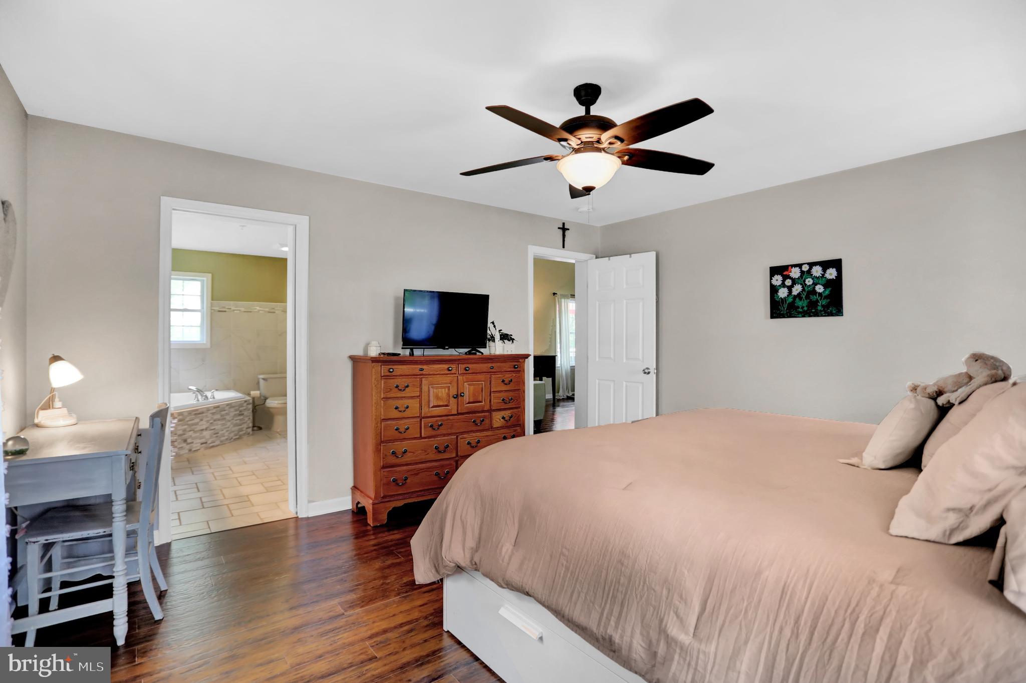 13008 Liberty Road Union Bridge, MD 21791 - Photo 10 of 69 a bedroom with a bed and a flat screen tv