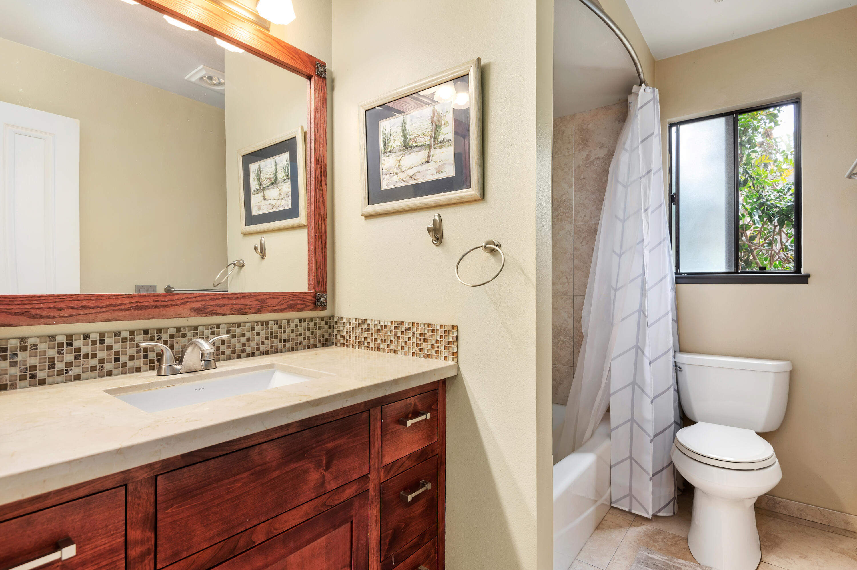 4344 Modoc Road, Unit 15 Santa Barbara, CA 93110 - Photo 11 of 19 a bathroom with a sink a toilet and mirror