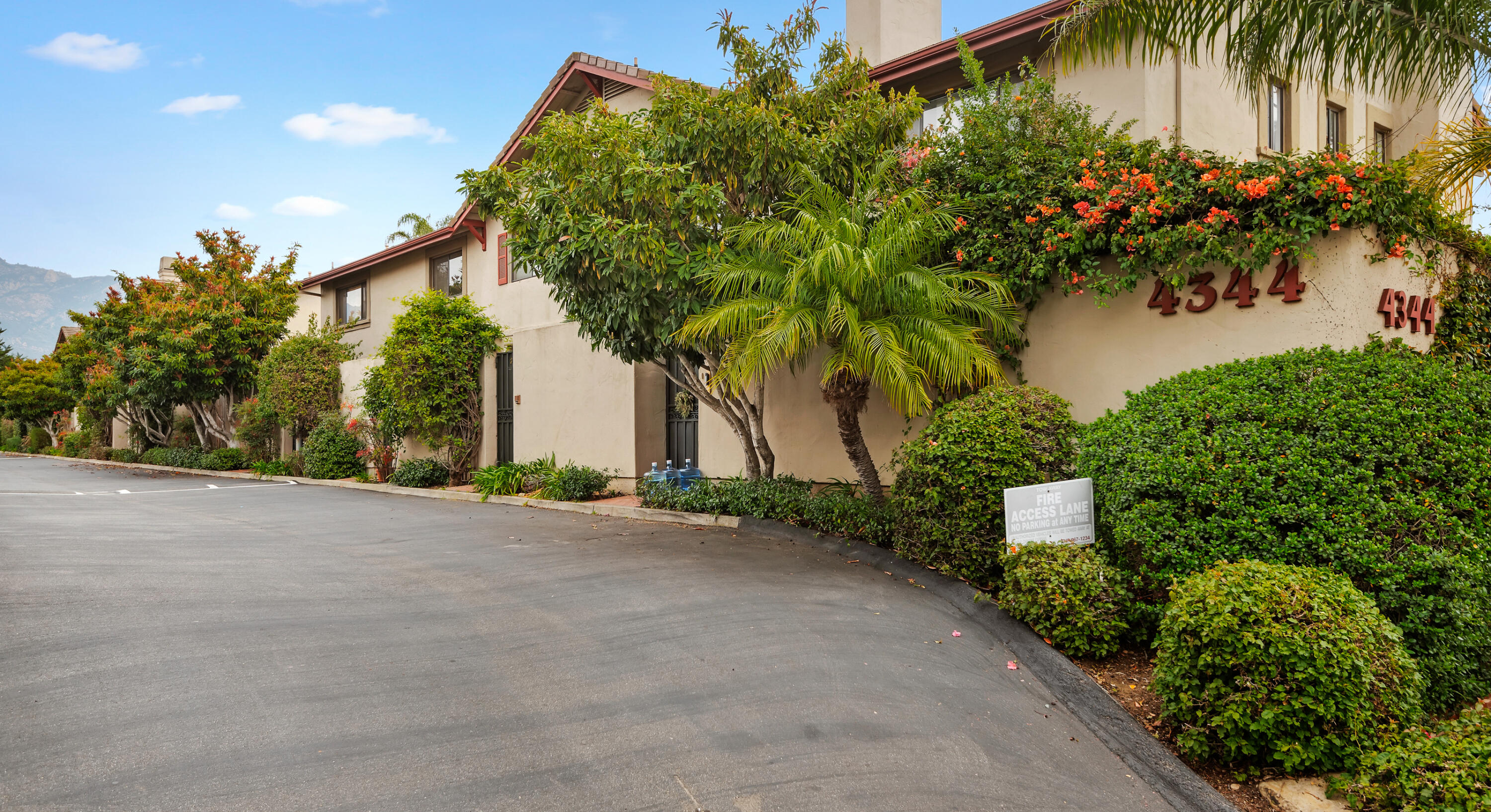 4344 Modoc Road, Unit 15 Santa Barbara, CA 93110 - Photo 19 of 19 a front view of a house with a yard and a garage