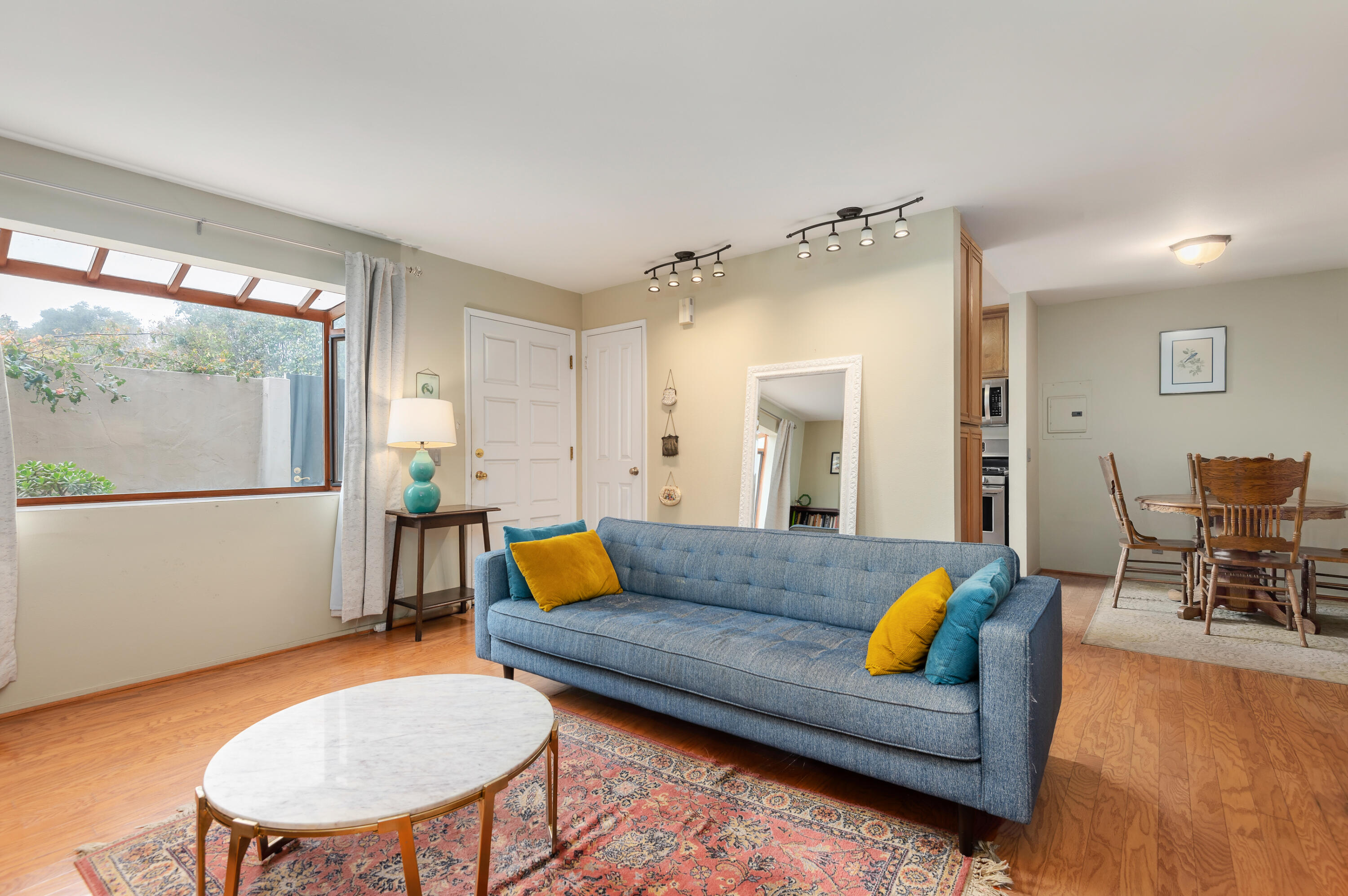 4344 Modoc Road, Unit 15 Santa Barbara, CA 93110 - Photo 2 of 19 a living room with furniture and a large window