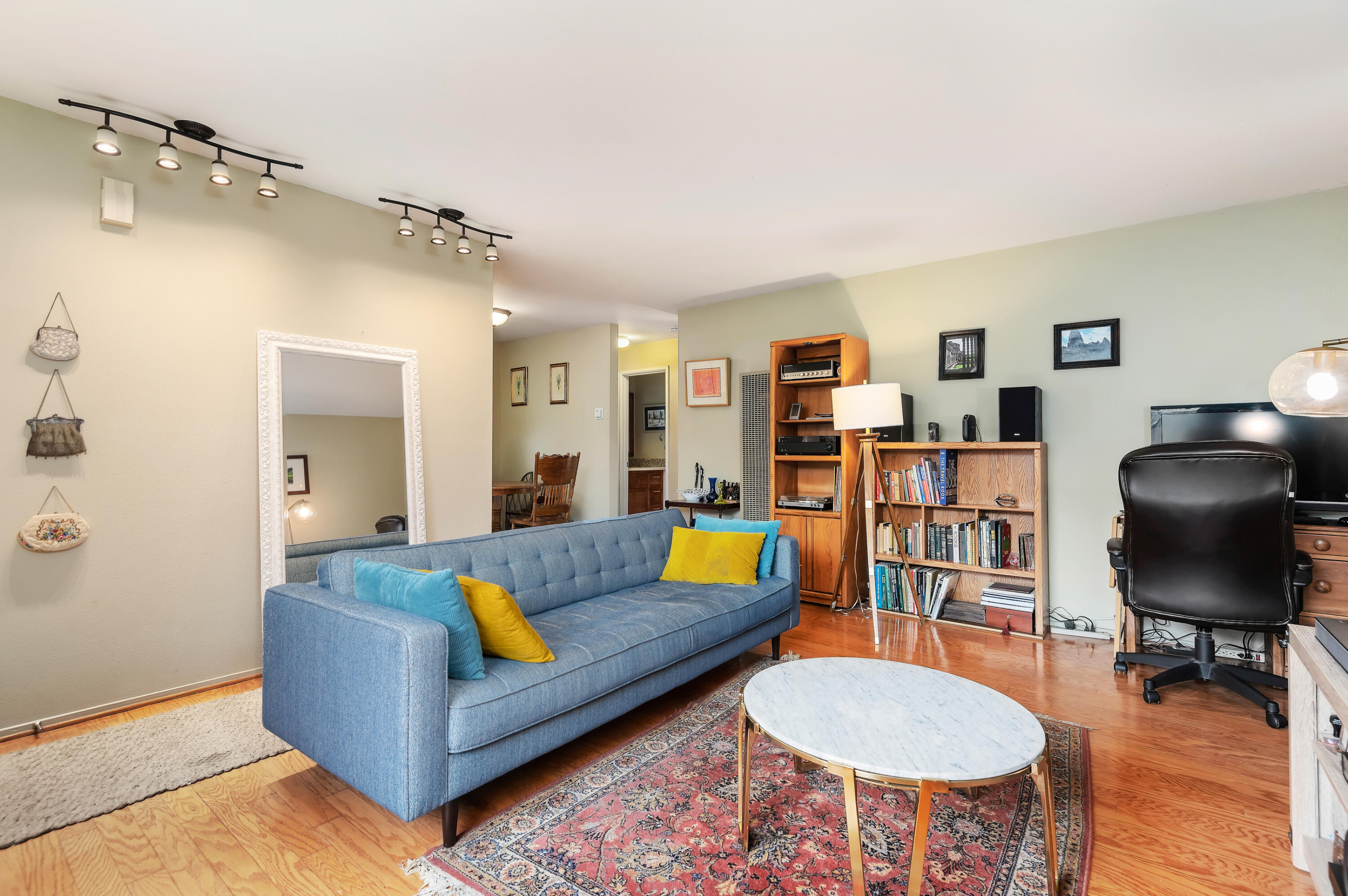 4344 Modoc Road, Unit 15 Santa Barbara, CA 93110 - Photo 4 of 19 a living room with furniture and a wooden floor