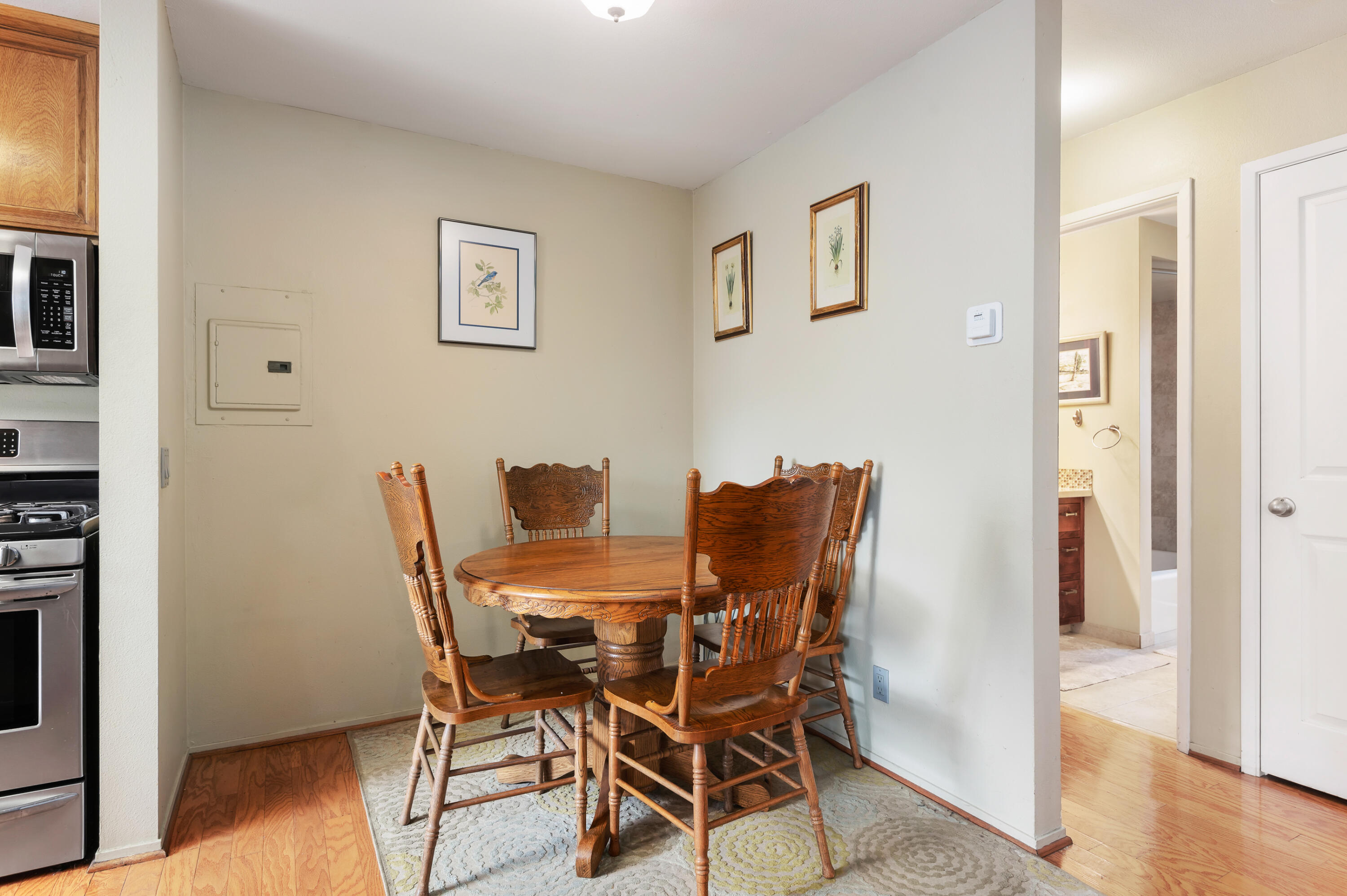 4344 Modoc Road, Unit 15 Santa Barbara, CA 93110 - Photo 8 of 19 a view of a dining room with furniture and wooden floor