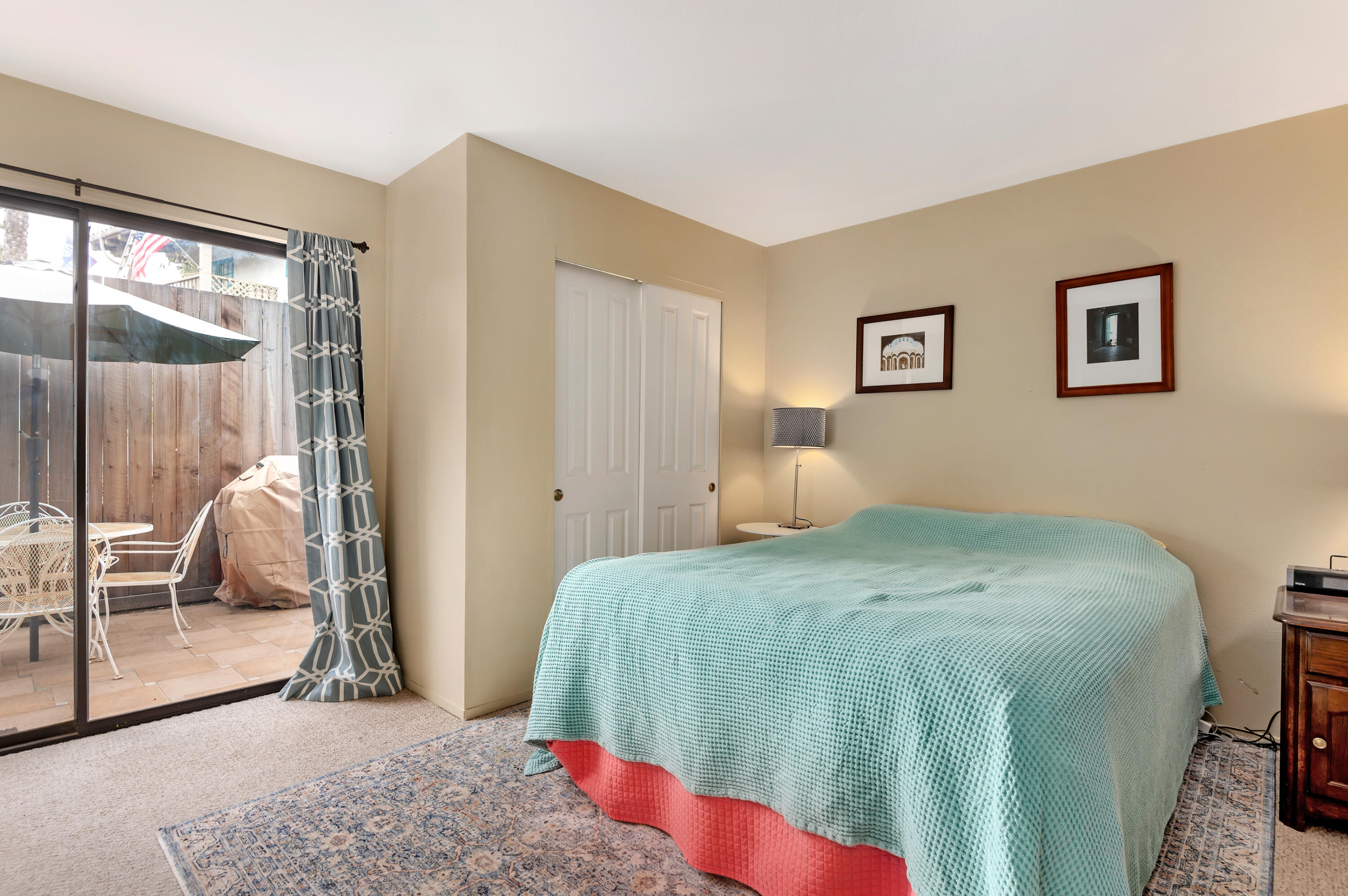 4344 Modoc Road, Unit 15 Santa Barbara, CA 93110 - Photo 9 of 19 a bedroom with a large bed and a large window