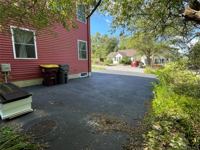 a view of a backyard with sitting area