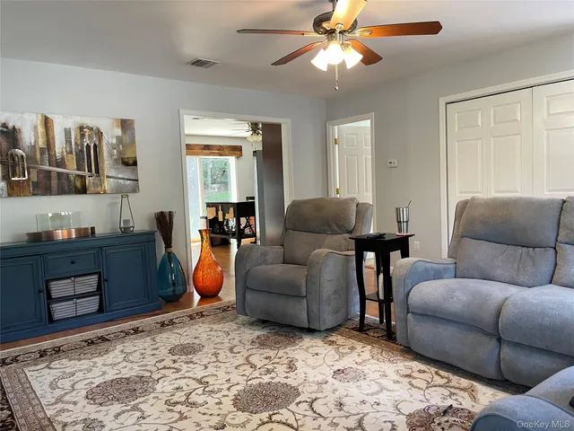 a living room with furniture and a rug