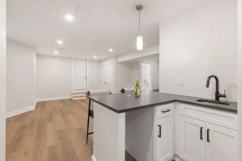 a kitchen with a sink and cabinets