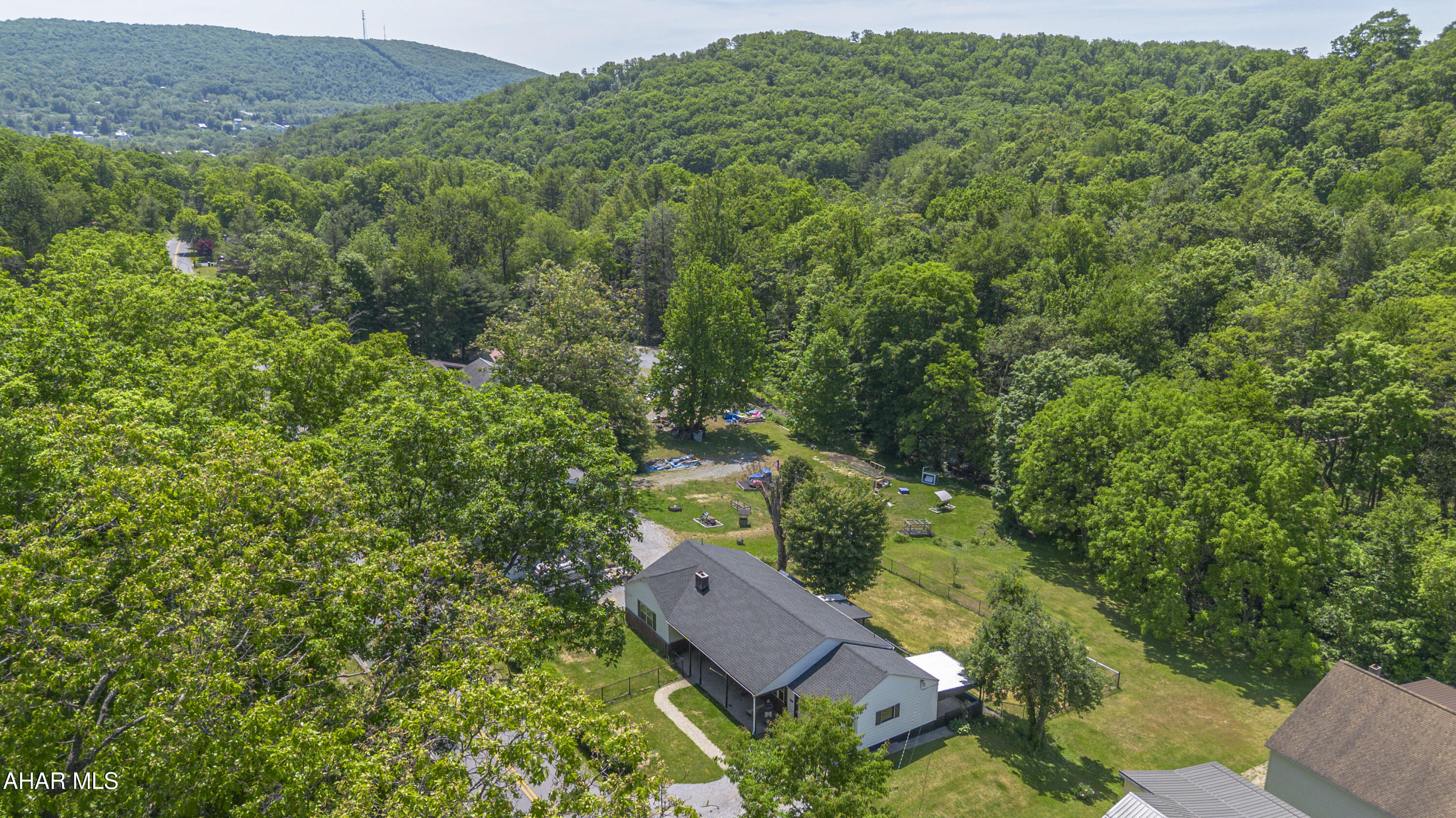 871 Decker Hollow Road Tyrone, PA 16686 - Photo 9 of 35 an aerial view of a house with yard and outdoor seating