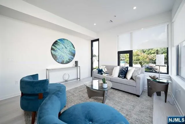 a living room with furniture and a large window