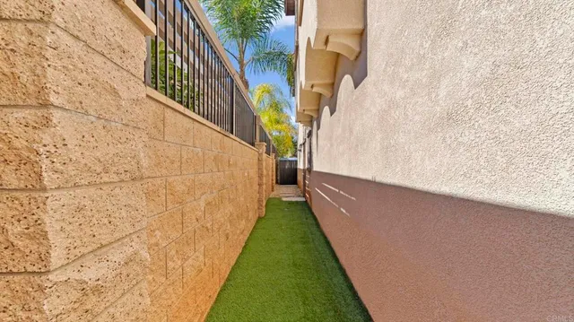 a backyard of a house with a garden