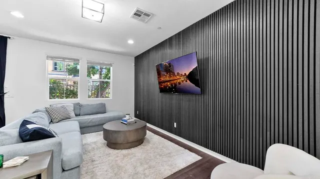 a bedroom with a bed and wall painting