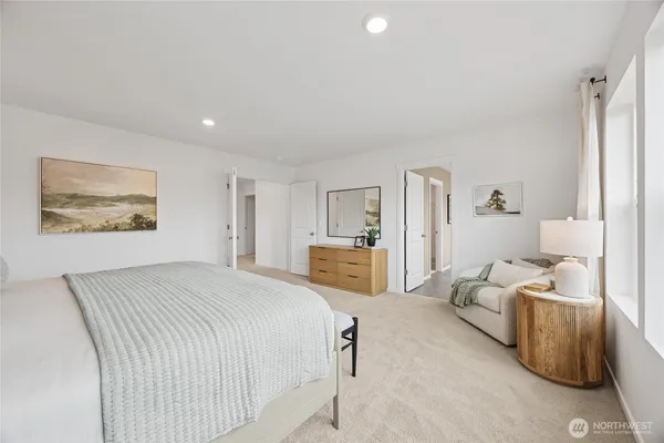 a bedroom with a bed and furniture