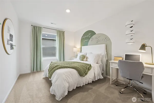 a bed room with a bed mirror and a window