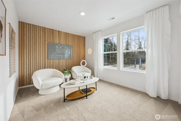 a living room with furniture and windows