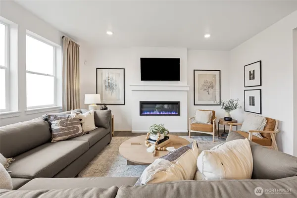 a living room with furniture fireplace and a flat screen tv