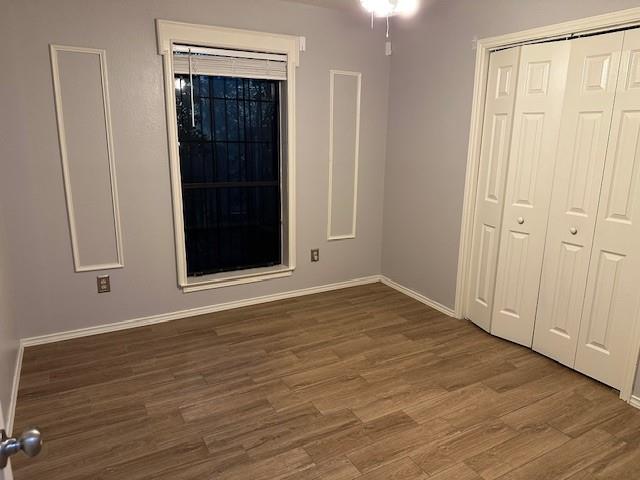 3133 Sappington Place, Unit C Fort Worth, TX 76116 - Photo 3 of 5 a view of an empty room with wooden floor
